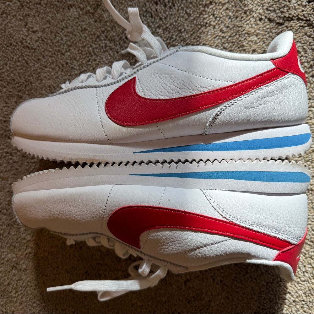 Nike White Sneakers with Red Swoosh and Blue Accent
